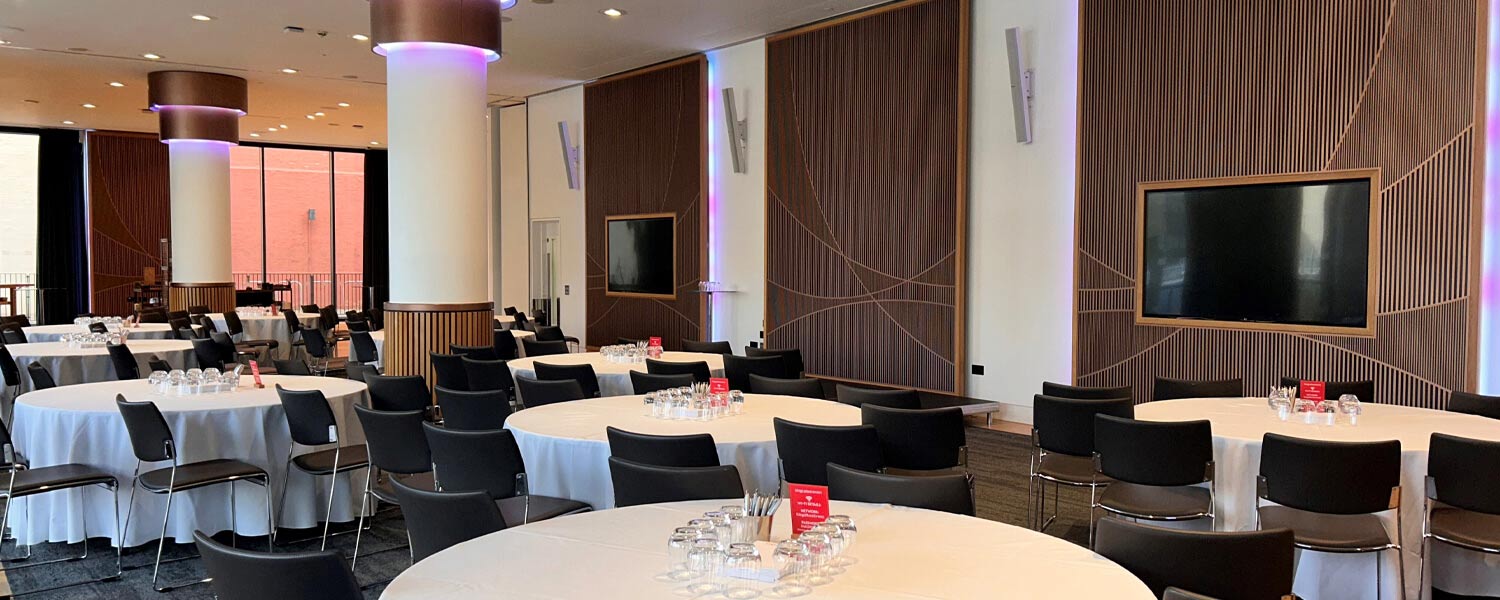 The newly upgraded Battlebridge Room at Kings Place, London, featuring a state-of-the-art AV system with Powersoft Mezzo amplifiers and Bose Professional speakers, designed for seamless event experiences.